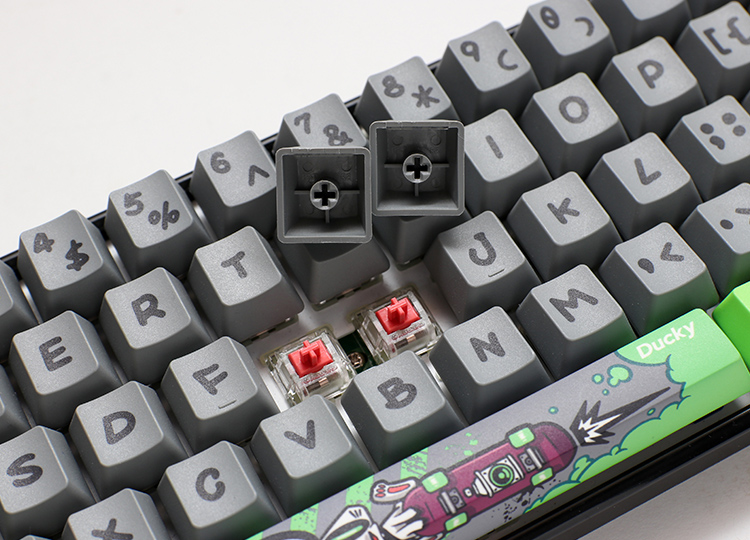 The artist has left his graffiti characters on the keycaps. Which look like they're on a brick wall, to the green mist arising from the keycaps. This allows him to hide and wittily contrasts the color around the mist. Above the mist, there are some familiar traffic symbols, aiding “Bounce Mouse” for his sense of direction when he travels and paints during the night.